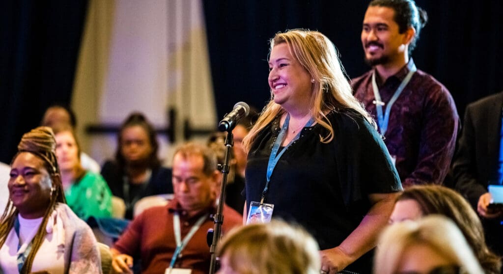 Pinnacle Member speaking into mic